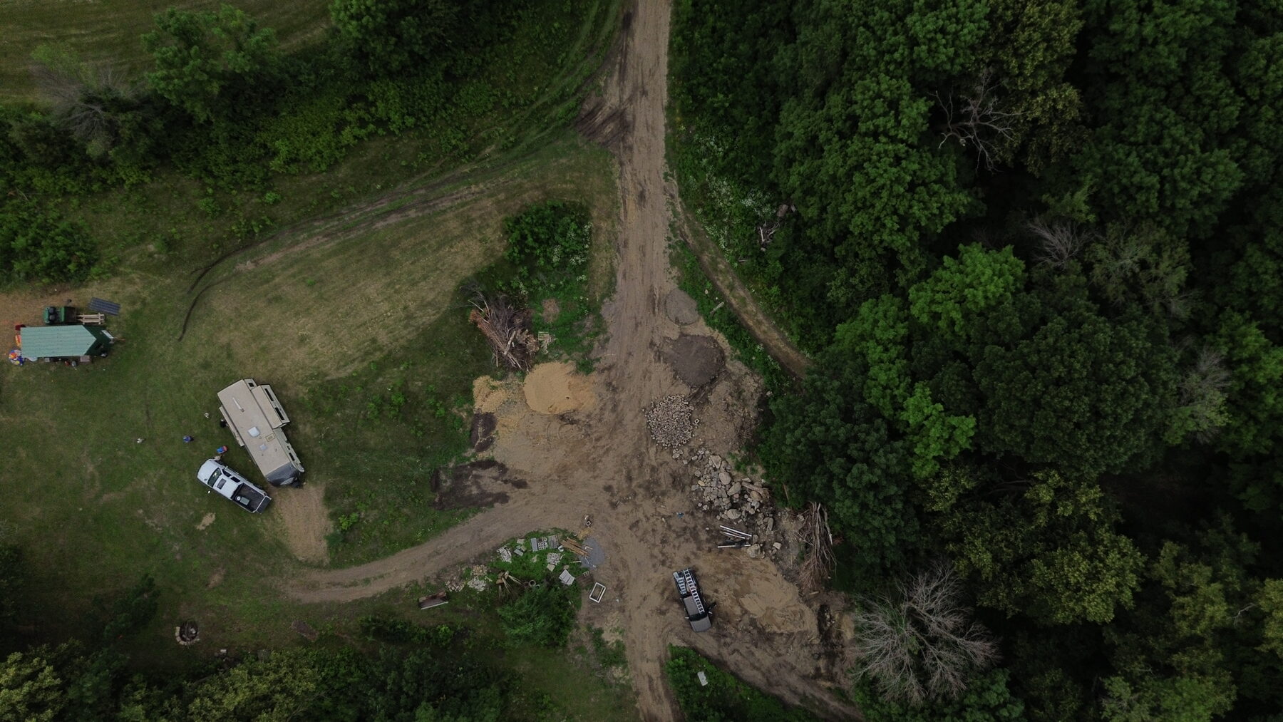 Existing farmstead and site access road before development